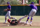 Lemoore's Anfernee Murrieta tags out Hanford's Clay
Gillum in a double play attempt Tuesday in a 5-4 loss to the Bullpups.
